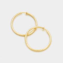 Clip on 1 1/4 indented gold spring back hoop earrings