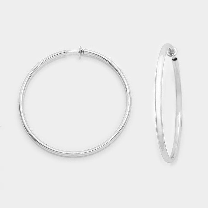 Clip on 1 1/4" shiny silver spring back hoop earrings