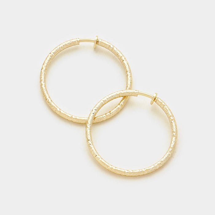 Clip on 1 3/4" gold sparkle spring back hoop earrings
