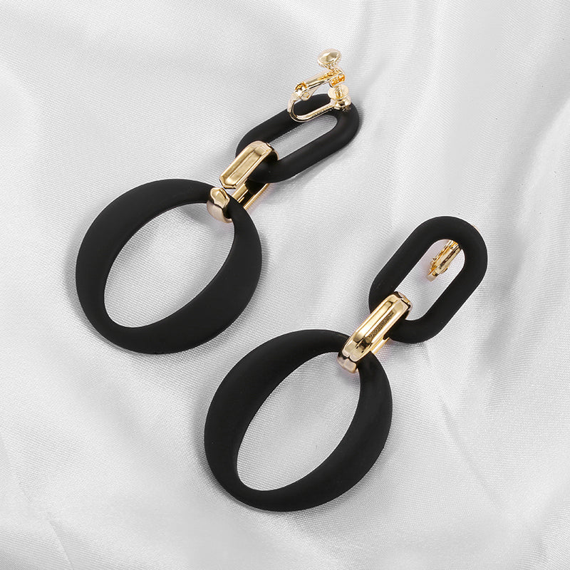 Clip on 2 1/3" vintage gold and black acrylic dangle oval hoop earrings