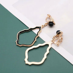 Clip on gold and black bead wavy edge earrings