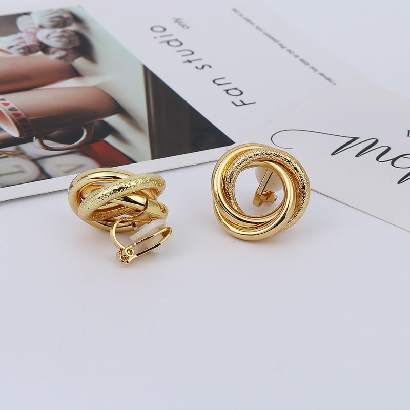 Clip on shiny and textured gold circle knot button earrings
