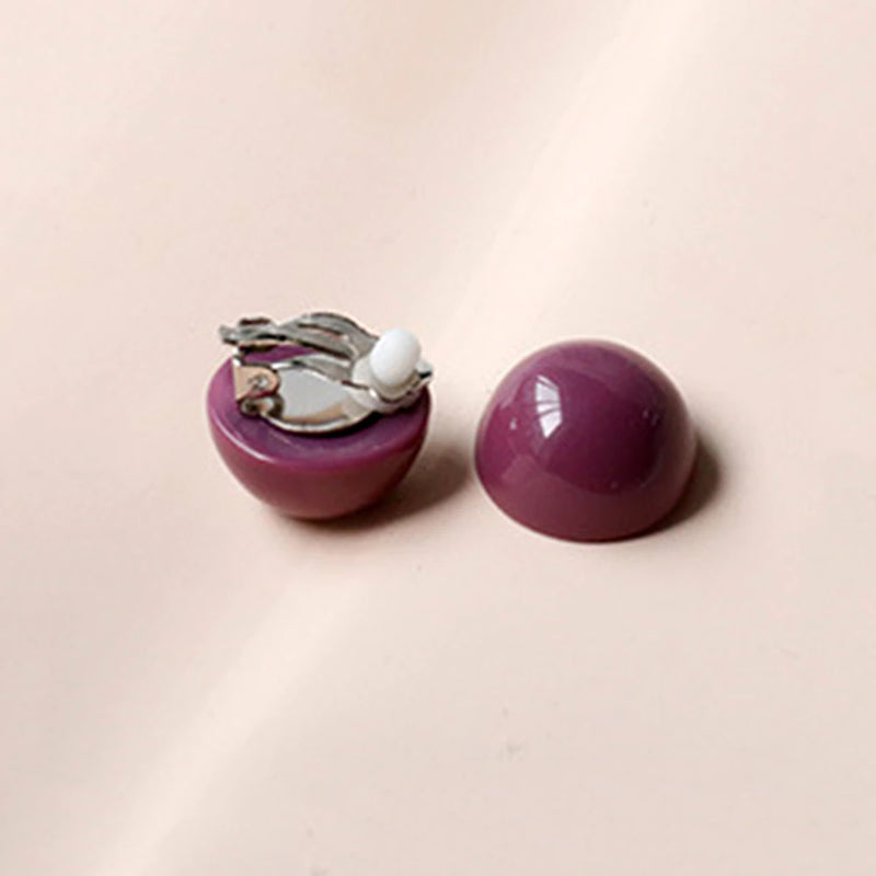 Clip on silver and purple round plastic earrings
