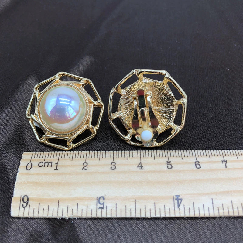 Clip on 1 1/4" gold and white pearl earrings with cutout edges