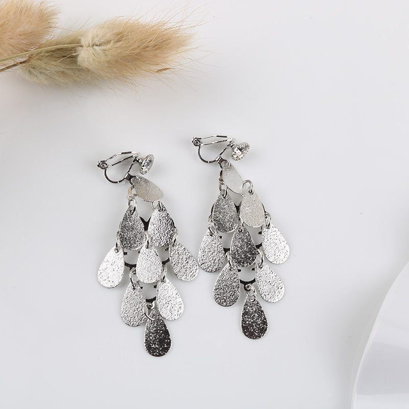 Clip on 2 3/4" silver textured layered teardrop dangle earrings
