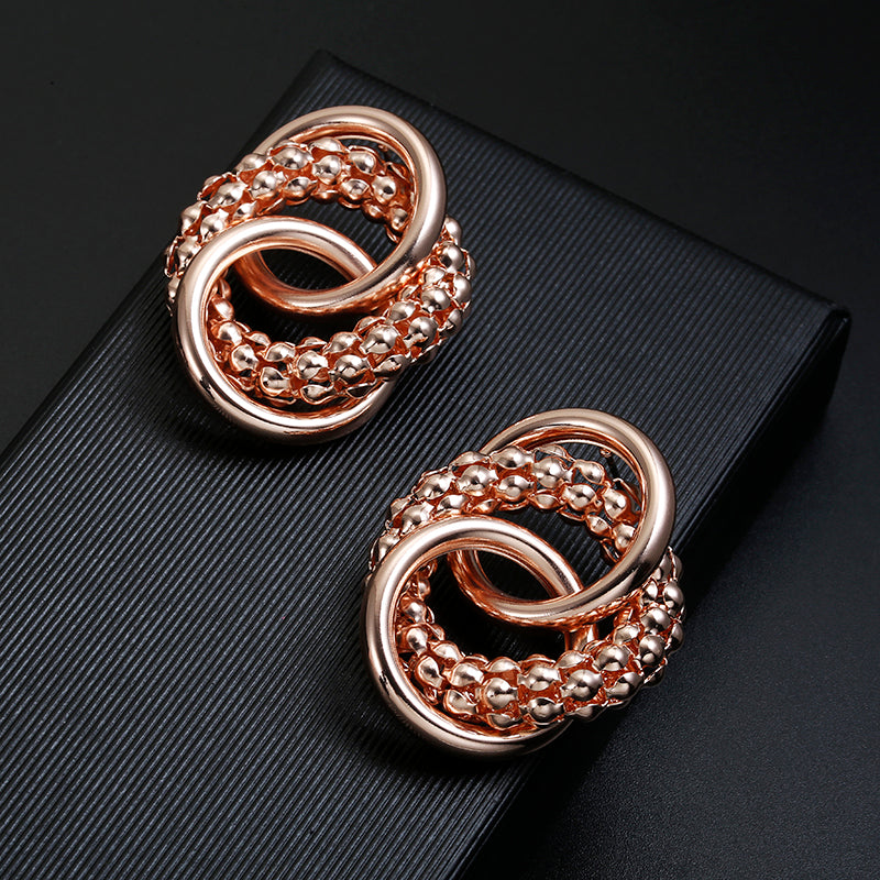 Clip on rose large textured loose knot shiny earrings