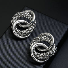 Clip on silver large textured loose knot shiny earrings