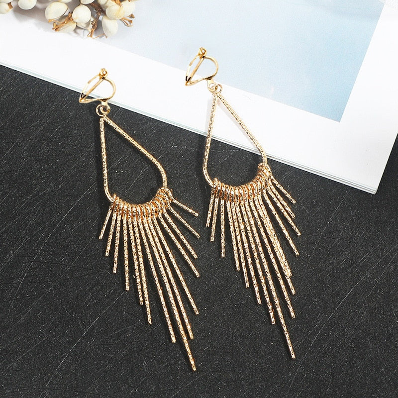 Trendy clip on long textured gold graduated spike earrings