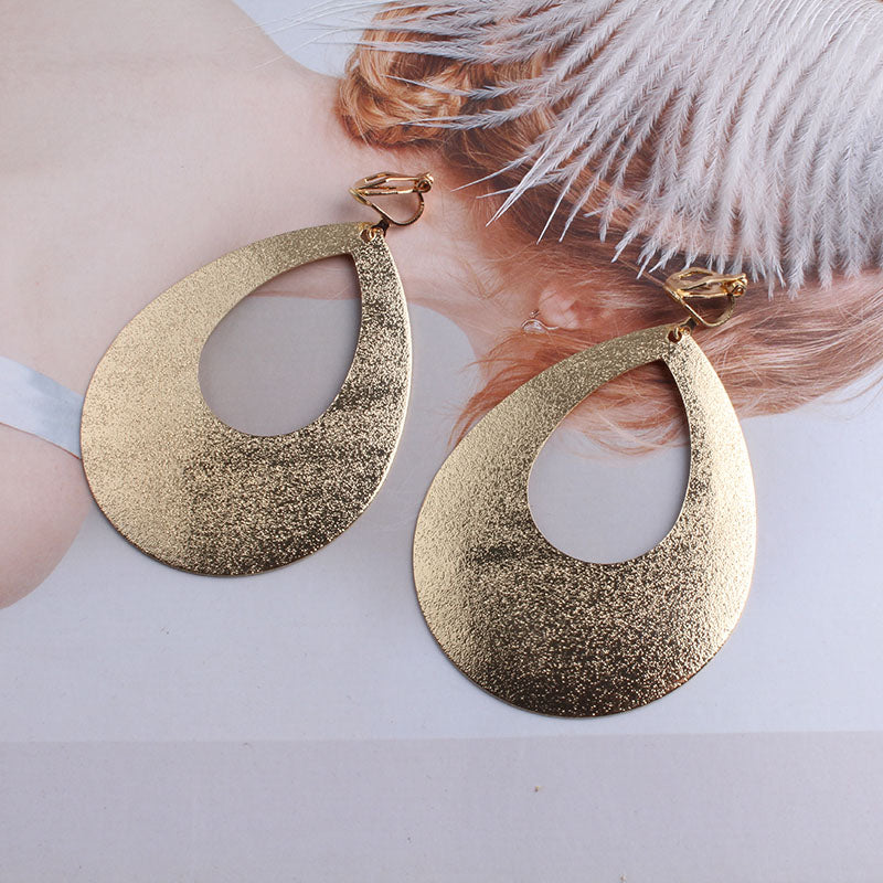 Clip on large textured gold cutout teardrop earrings