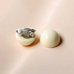 Clip on silver and cream round plastic earrings