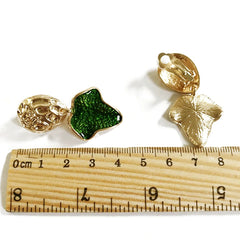 Clip on gold and green leaf dangle earrings