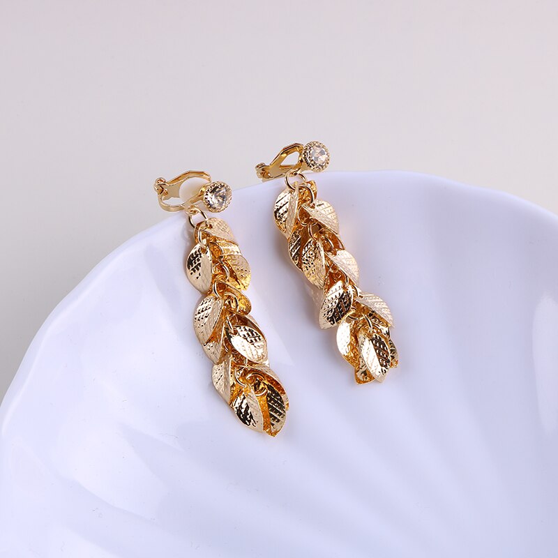 Clip on 2 1/2" long gold cluster leaf earrings with small clasp