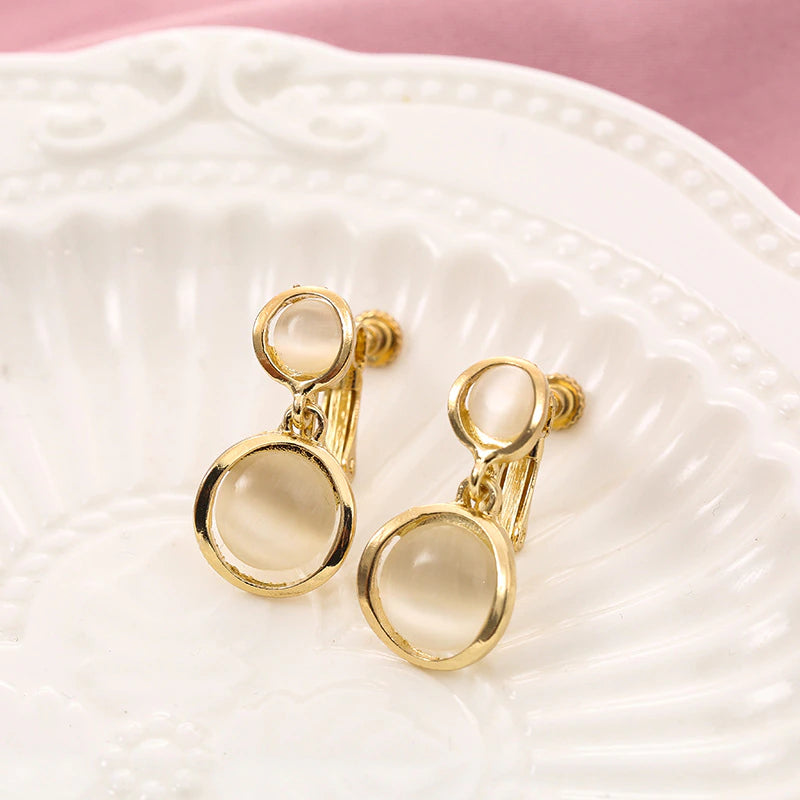 Clip on gold double round cream stone dangle earrings