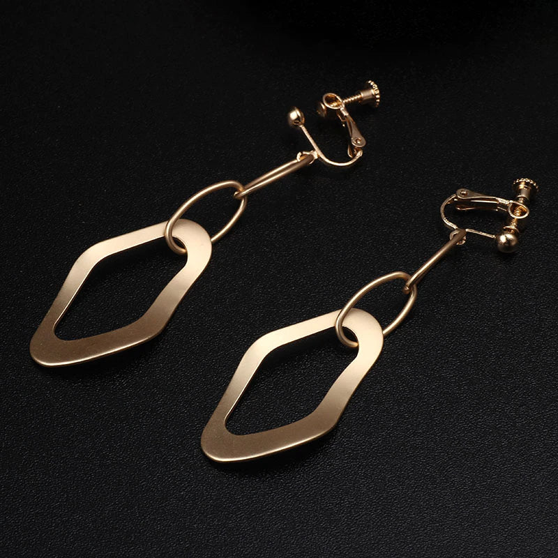 Clip on 3 1/4" long matte gold dangle odd shaped bent hoop earrings