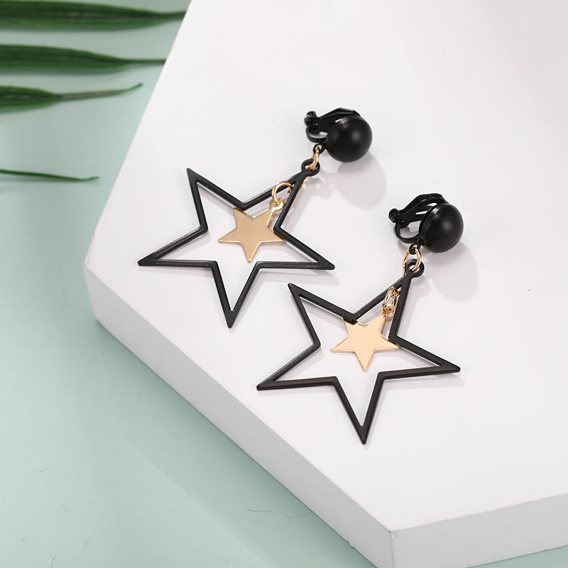 Clip on 2 1/4" black and gold dangle star earrings