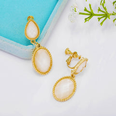Clip on gold and cream sparkle stone dangle earrings