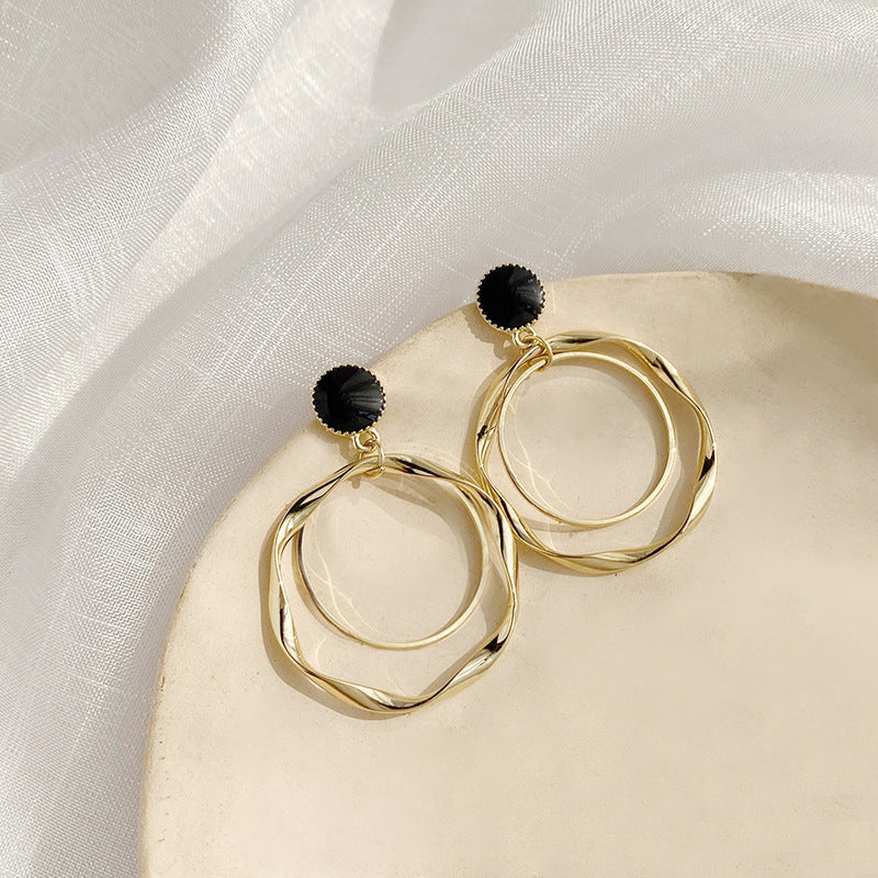 Clip on black and gold twisted double hoop earrings