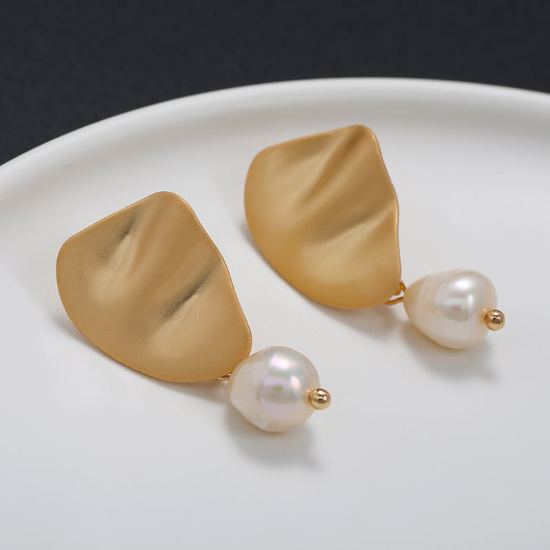 Clip on wavy matte gold earrings with dangling pearl