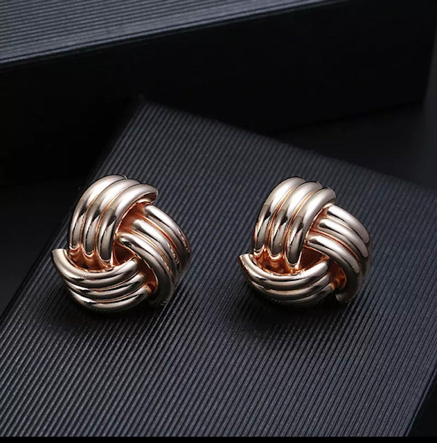 Clip on rose indented knot button earrings