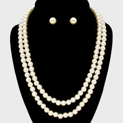 Pierced gold double strand cream pearl necklace and earring set