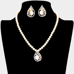 Pierced gold, white pearl pointed necklace and earring set with clear stones