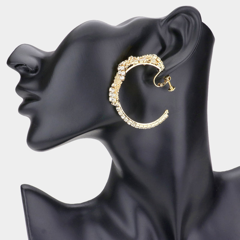 Clip on 1" gold and black cutout scoop style earrings with clear stones