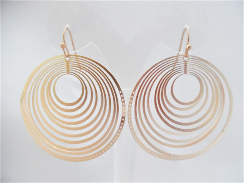 Pierced matte gold lightweight cutout circle earrings