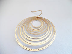 Pierced matte gold lightweight cutout circle earrings