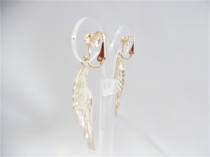 Clip on gold indented dangle wing earrings