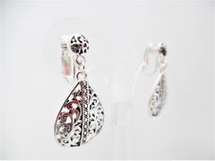 Clip on silver teardrop flowered dangle earrings