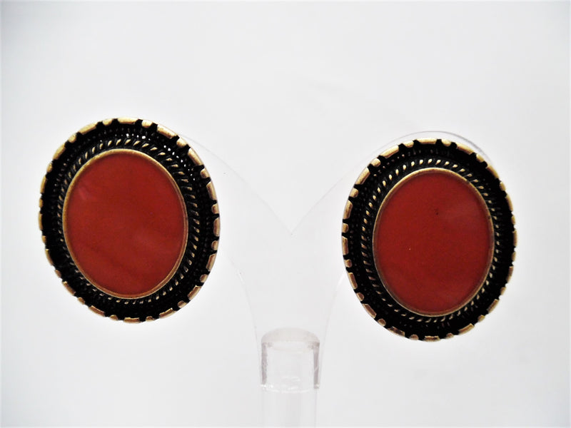 Clip on 1 1/4" brass and orange stone oval button style earrings