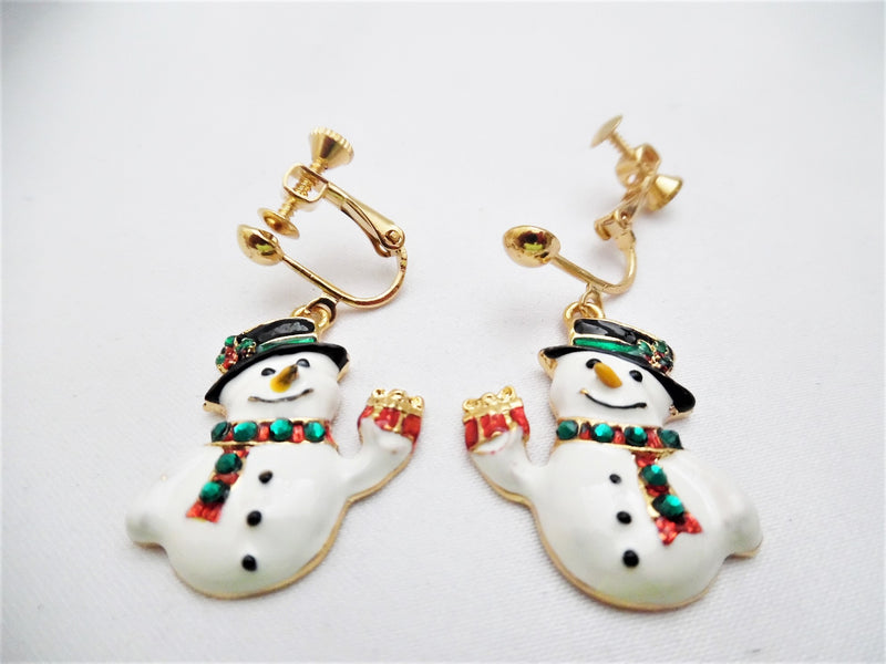 Gold 1 1/2" white, green, black Snowman dangle earrings with red stones