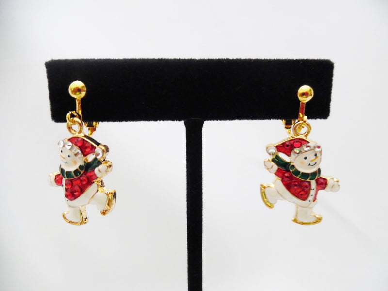 Clip on 1 1/2" gold, white multi colored dangle skating snowman earrings